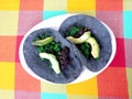 Chorizo Ã¢â¬â¹Ã¢â¬â¹tacos or green longaniza, ground pork meat in blue tortilla with avocado, Mexican gastronomic specialty